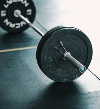a close up of a barbell on a gym floor