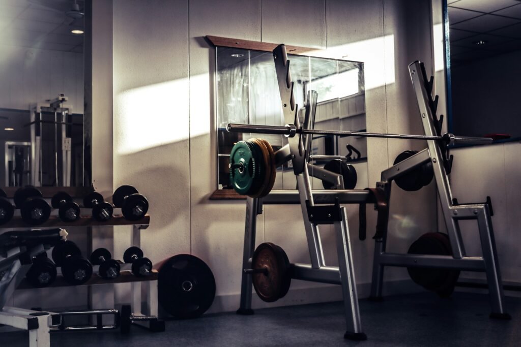 squat rack and dumbbell rack in a gym